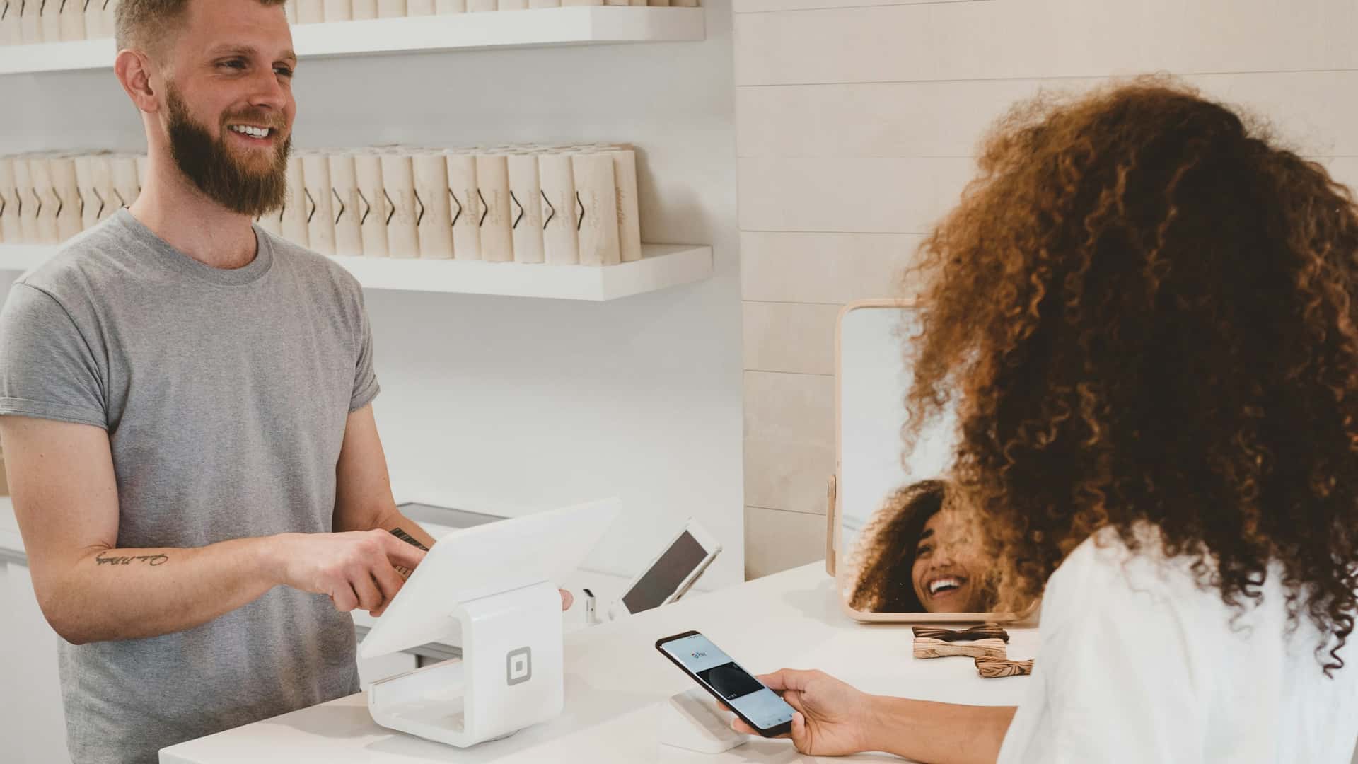 Online shopping with a laptop and a credit card in hand.