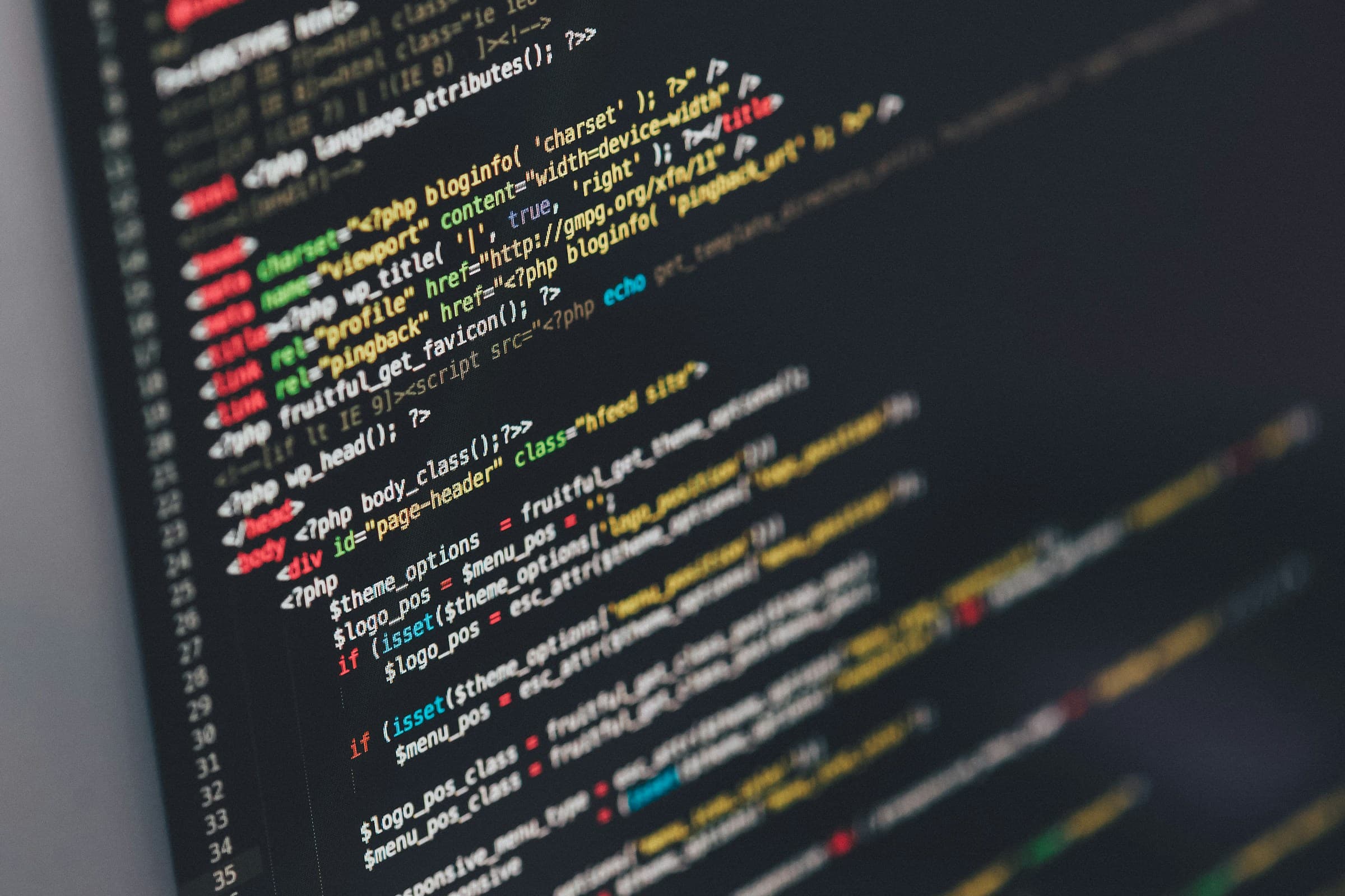 Colorful source code on a dark screen.
