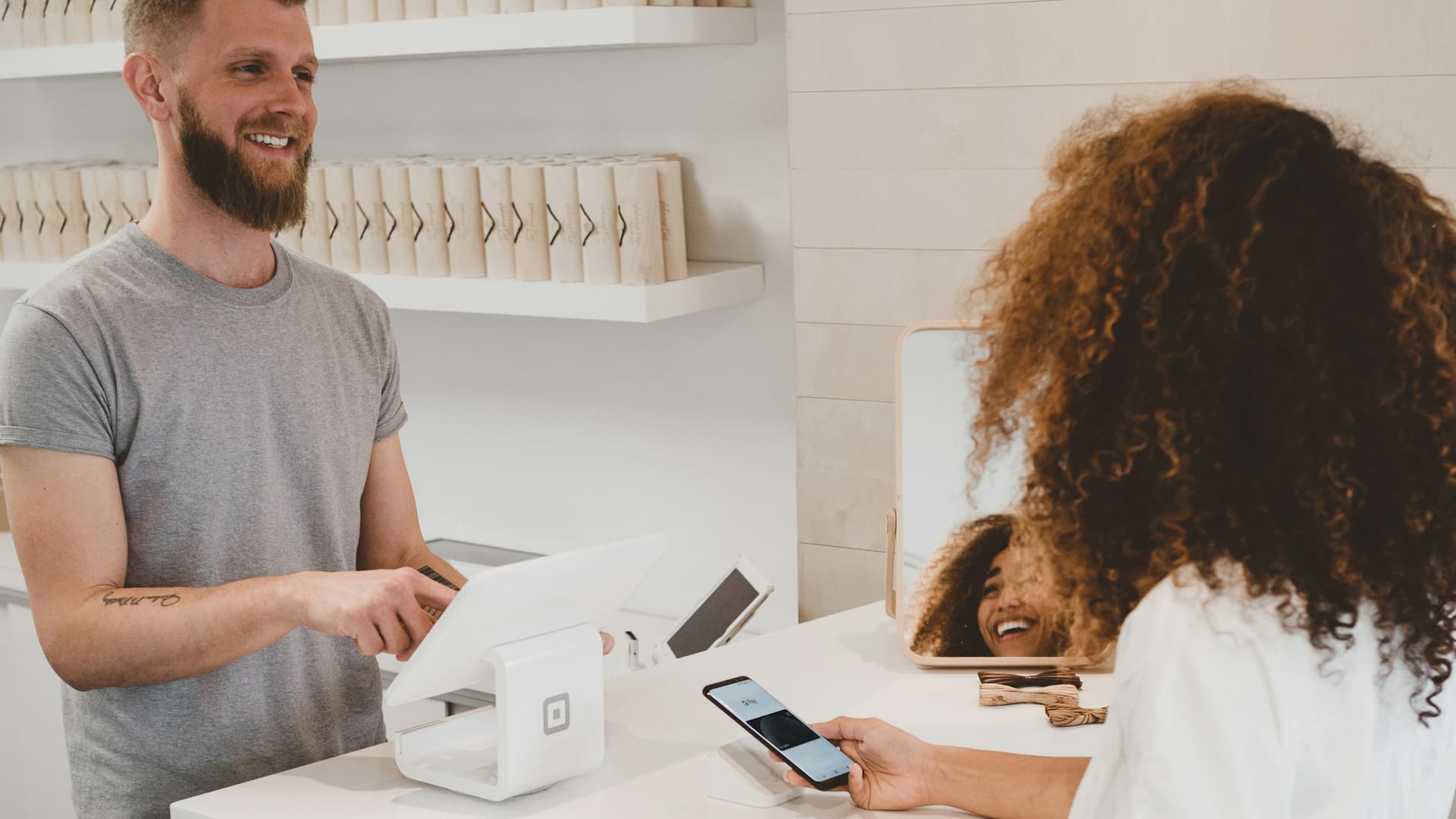 Online shopping with a laptop and a credit card in hand.