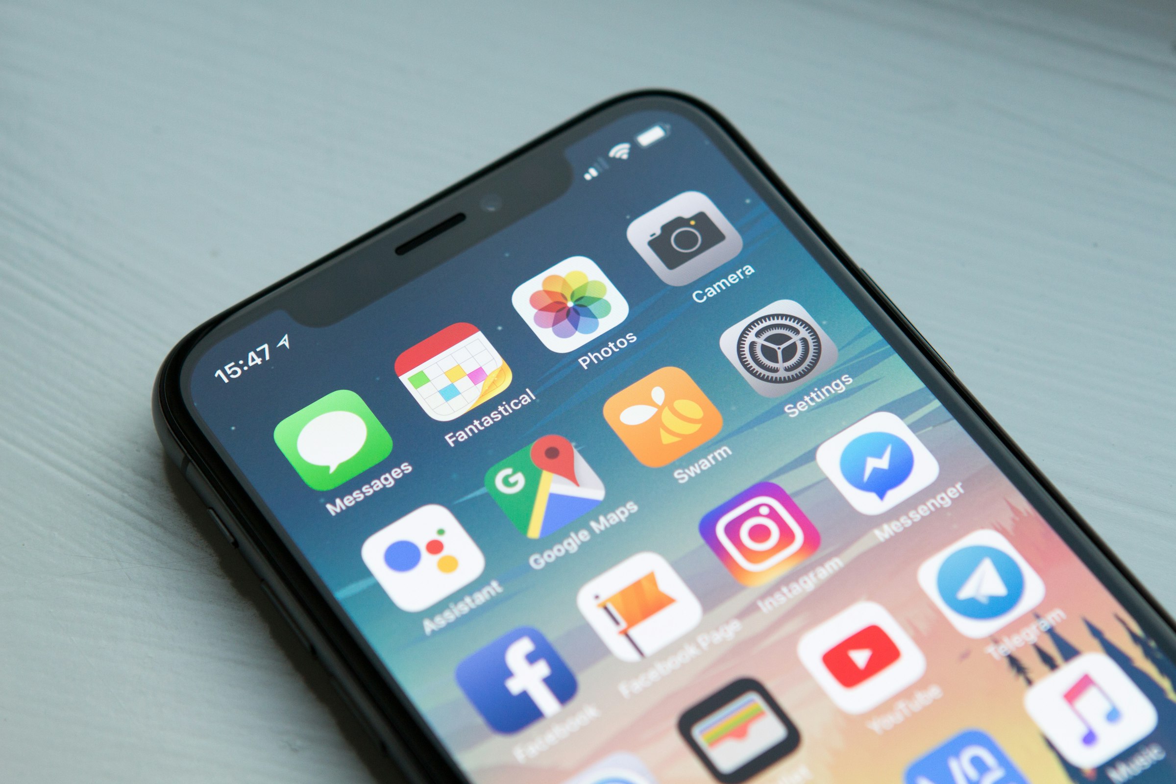 Stylized illustration of two phones running a modern mobile app.