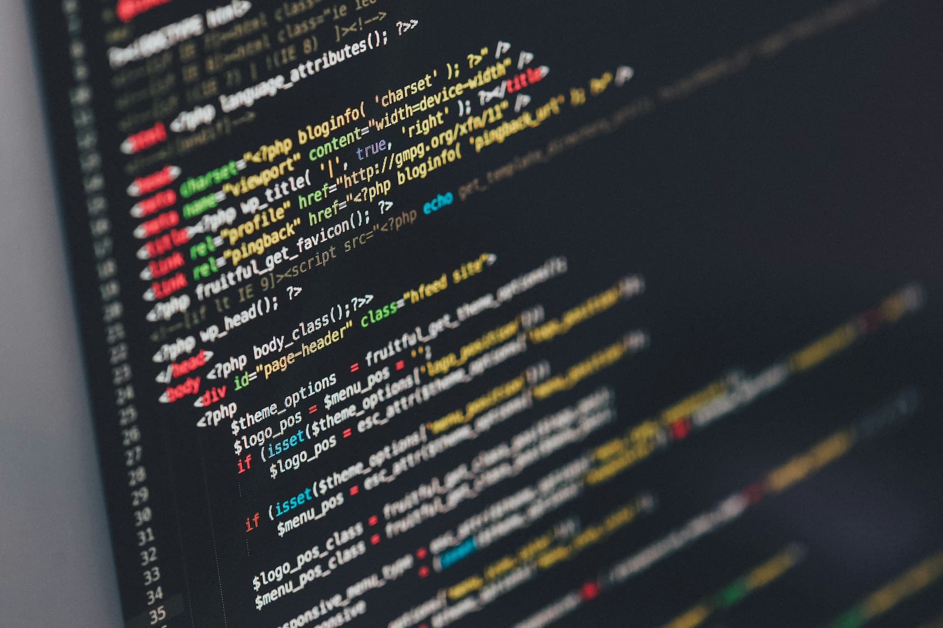 Colorful source code on a dark screen.